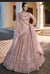 Designer lehenga in peach pink for wedding celebrations in London
