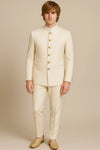 Full front view of an ivory Jodhpuri suit with matching trousers and gold-tone buttons for a Jaipur wedding
