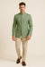 Front view of sage green Bandhgala Jodhpuri suit with gold-tone buttons and beige trousers for a Jaipur wedding