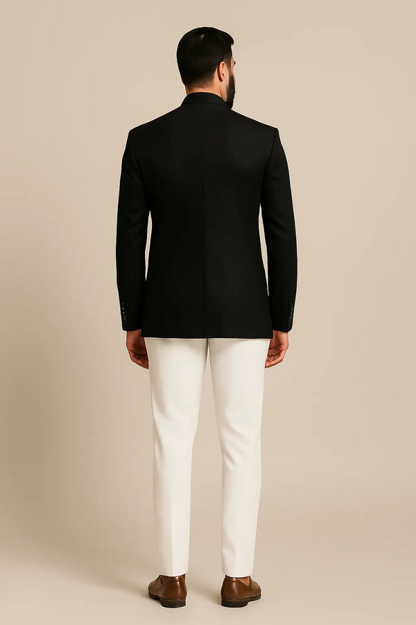 Back view of black Jodhpuri coat with contrasting ivory trousers for a London wedding guest look