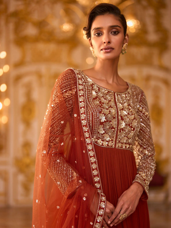 Front view of Rust Orange embroidered Anarkali suit for a New York wedding guest