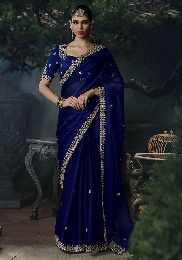 Navy Blue Tissue Silk Organza Designer Saree displaying an intricate fancy border for grand festive parties | BharatPlaza