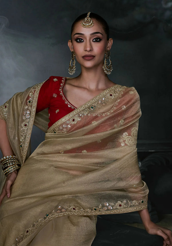 Golden Beige Tissue Silk Organza Saree displaying a contrasting red embroidered blouse for grand events | BharatPlaza