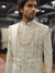 Custom made cream silk sherwani for an Indian groom handwork zari, resham, and moti work bharatplaza