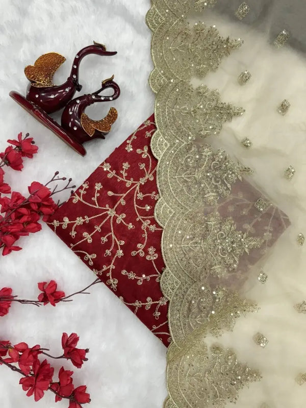 Red embroidered blouse with organza silk saree