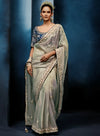 Silver Grey Fancy Fabric Designer Saree showcasing an elegant peacock motif blouse for luxury wedding wear | BharatPlaza
