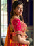 Pink and mustard Banarasi silk bridal lehenga with zari and crystal work for a luxury wedding in New York