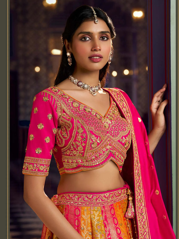 Pink and yellow Banarasi silk bridal lehenga with zari and crystal work for a grand Indian wedding in Dallas