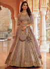 Lavender Banarasi Silk Designer Lehenga featuring a gorgeous 4m flair and matching clutch for wedding wear | BharatPlaza