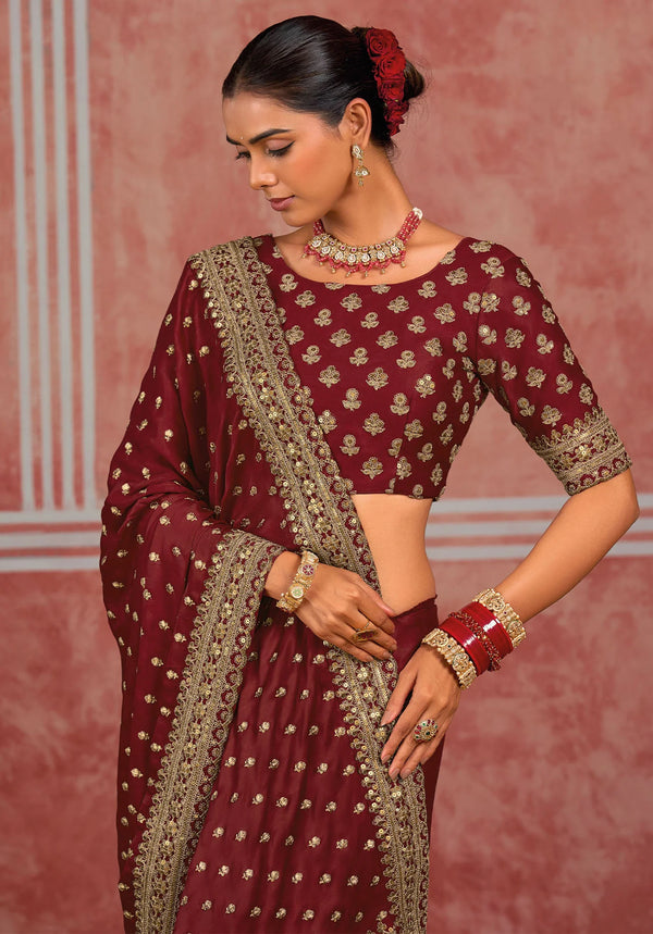 Maroon Munga silk designer saree with intricate golden handwork and matching blouse