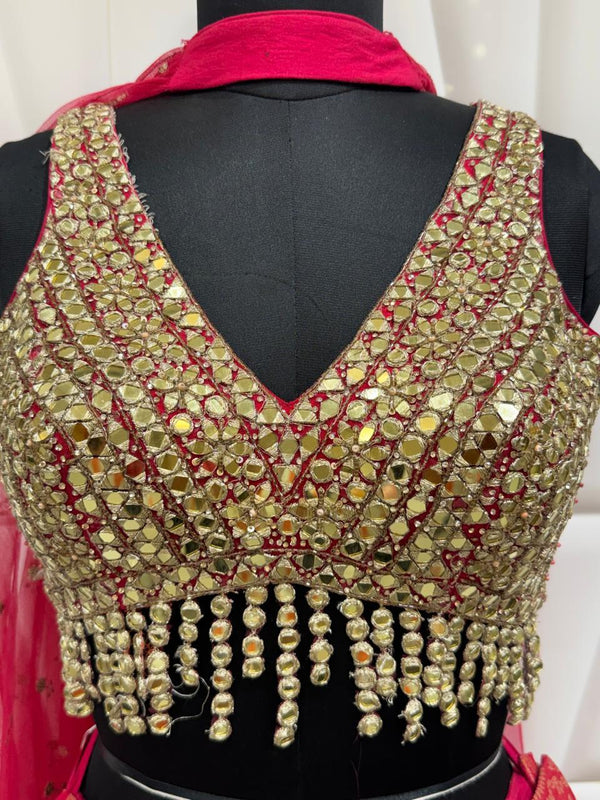Front Choli Design Of Hot Pink Indo Western Blouse With Mirror Work And Stylish V Neck