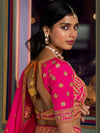 Back view of pink Banarasi bridal blouse with tie-up tassels and zari embroidery for a wedding in London