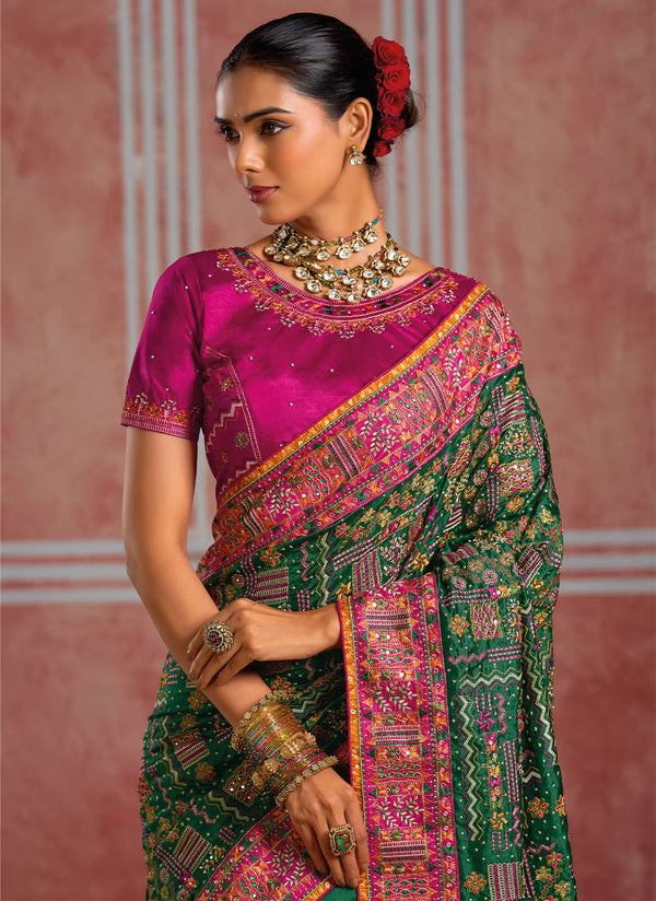 Emerald Green Shana Silk Designer Saree paired with a heavy vibrant pink blouse for wedding & festive wear | BharatPlaza