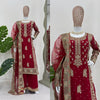 Red embroidered traditional outfit on a girl with a white background
