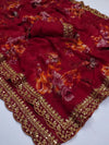 Fabric drape of red georgette floral saree with golden foil border