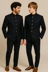 Two men in black Bandhgala Jodhpuri suits with matching trousers for a Toronto wedding guest look