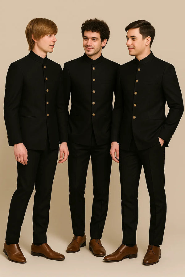Three men wearing coordinated black Jodhpuri suits with gold-tone buttons for a Mumbai wedding