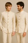 Two men in ivory Bandhgala Jodhpuri suits with gold-tone buttons for a Brampton wedding celebration