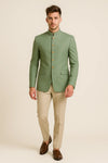 Front view of sage green Bandhgala Jodhpuri suit with gold-tone buttons and beige trousers for a Jaipur wedding