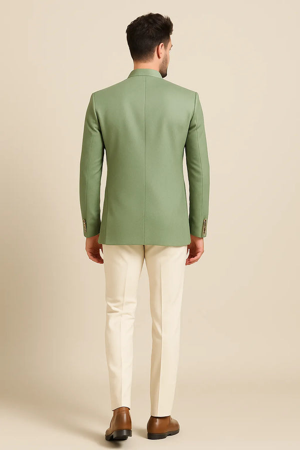 Back view of sage green Jodhpuri coat with contrasting beige trousers for a Bengaluru engagement look
