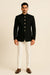 Full front view of black Bandhgala Jodhpuri suit with gold-tone buttons and ivory trousers for an Ahmedabad wedding