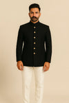 Front view of black Jodhpuri suit and ivory trousers styled for the father of the groom at a Brampton reception