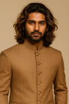 Close-up of camel brown Bandhgala Jodhpuri suit showing its ornate gold-tone buttons for a London wedding guest look