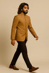 Side view of camel brown Jodhpuri suit with dark brown trousers for a Chicago wedding guest look