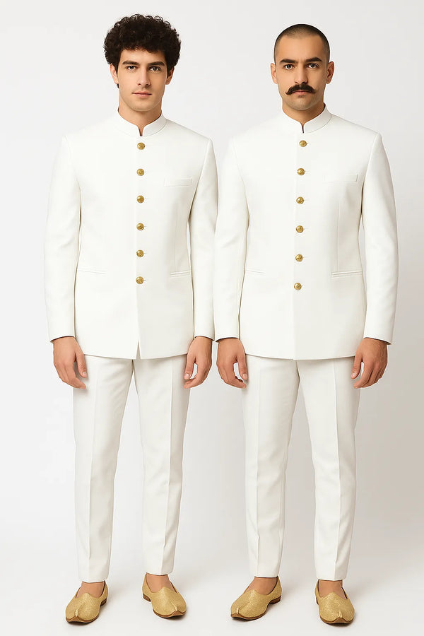 Two men in coordinated white Jodhpuri suits with gold-tone buttons for an Indian family wedding in Paris
