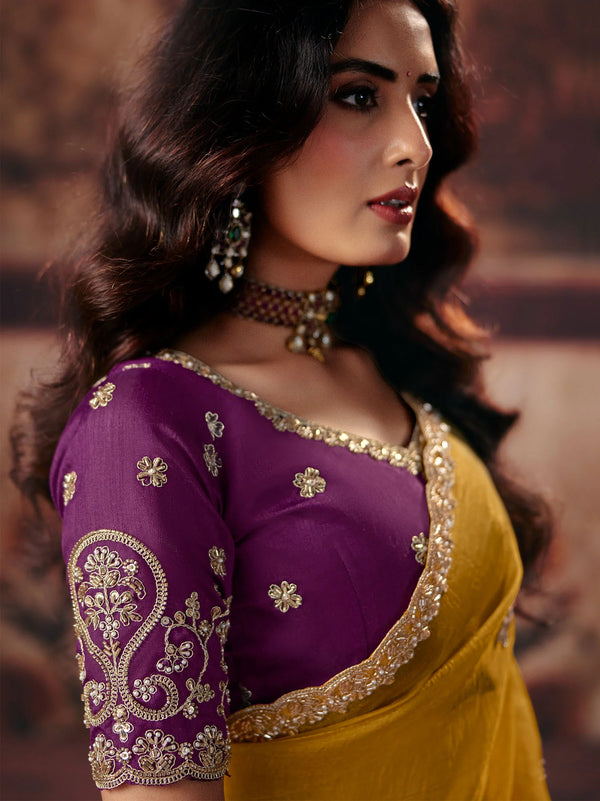 Mustard Yellow Premium Organza Saree featuring a contrasting purple blouse for wedding & festive wear | BharatPlaza