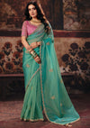 Sea Green Premium Organza Designer Saree showcasing a contrasting pink blouse for wedding & festive wear | BharatPlaza