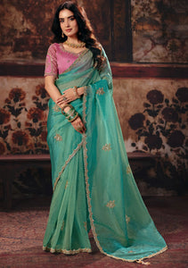 Sea Green Premium Organza Designer Saree showcasing a contrasting pink blouse for wedding & festive wear | BharatPlaza