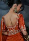 Rust Orange Tissue Silk Organza Designer Saree highlighting intricate back blouse sequence work for weddings | BharatPlaza