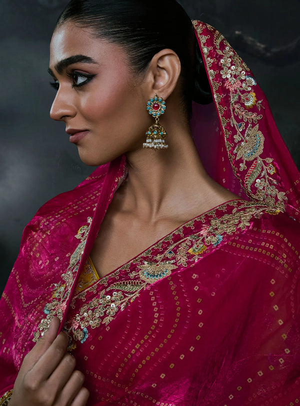 Rani Pink Tissue Silk Organza Designer Saree featuring an elegant drape over the head for luxury wedding wear | BharatPlaza