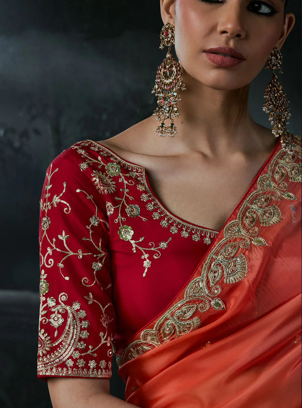 Coral Red Tissue Silk Organza Designer Saree displaying intricate sequence and stone work on the blouse | BharatPlaza