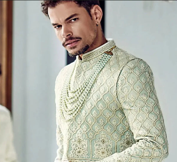 Elegant mint green Sherwani with cutdana & beads work closeup