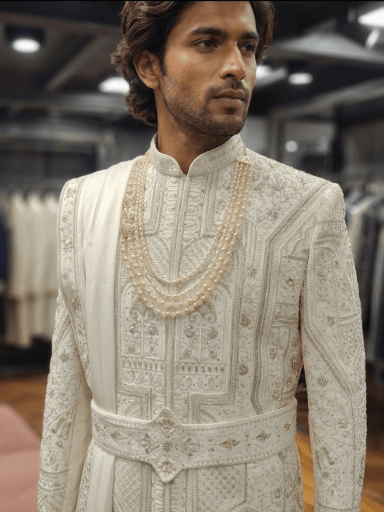 Custom made cream silk sherwani for an Indian groom handwork zari, resham, and moti work bharatplaza