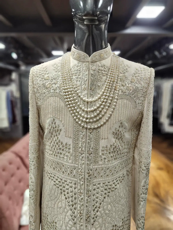 Royal Resham embroidered with zari and bead work on a men's sherwani for Indian Groom in California