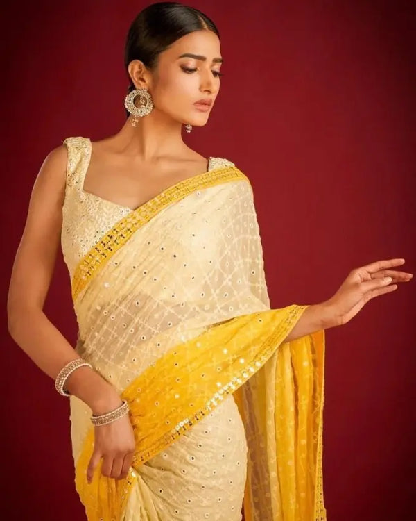 ellow–white ombre shaded georgette saree with mirror work embroidery