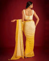 Yellow–white shaded georgette saree with embroidered blouse