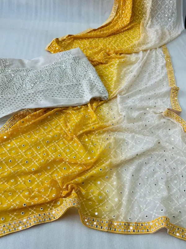 Yellow–white ombre Shaded saree fabric spread with mirror work detailing
