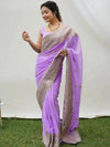  Model wearing lavender faux georgette saree with zari border embroidery