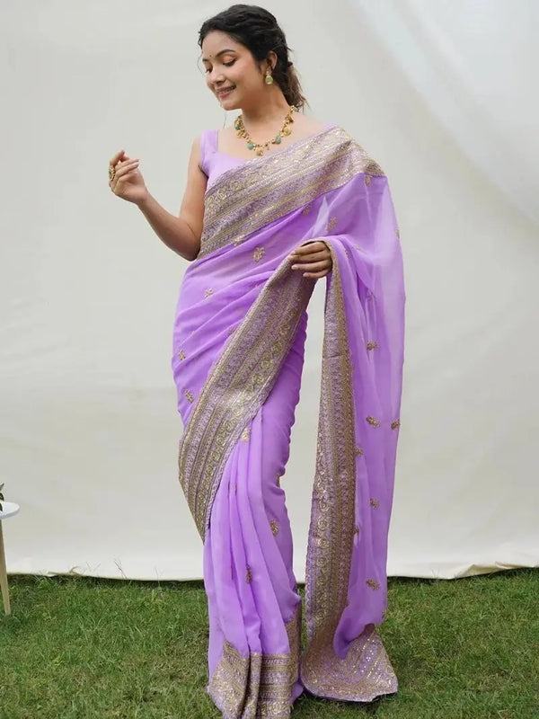 Model wearing lavender faux georgette saree with zari border embroidery