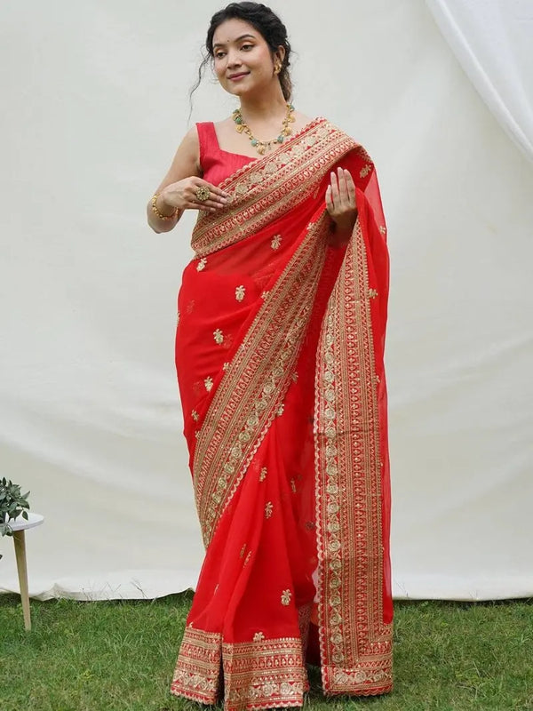 Model wearing red faux georgette saree with zari lace border