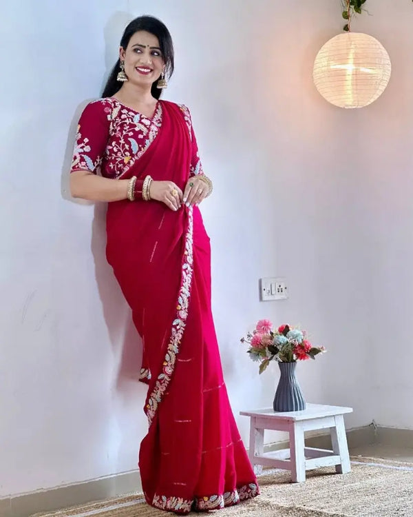 Rani Pink chiffon saree with designer blouse, standing pose