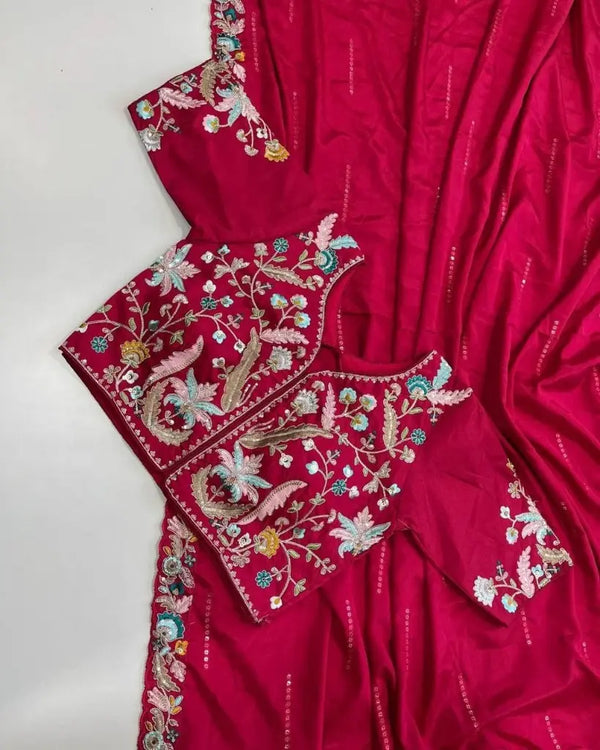 Flatlay of Rani Pink embroidered chiffon saree with designer blouse