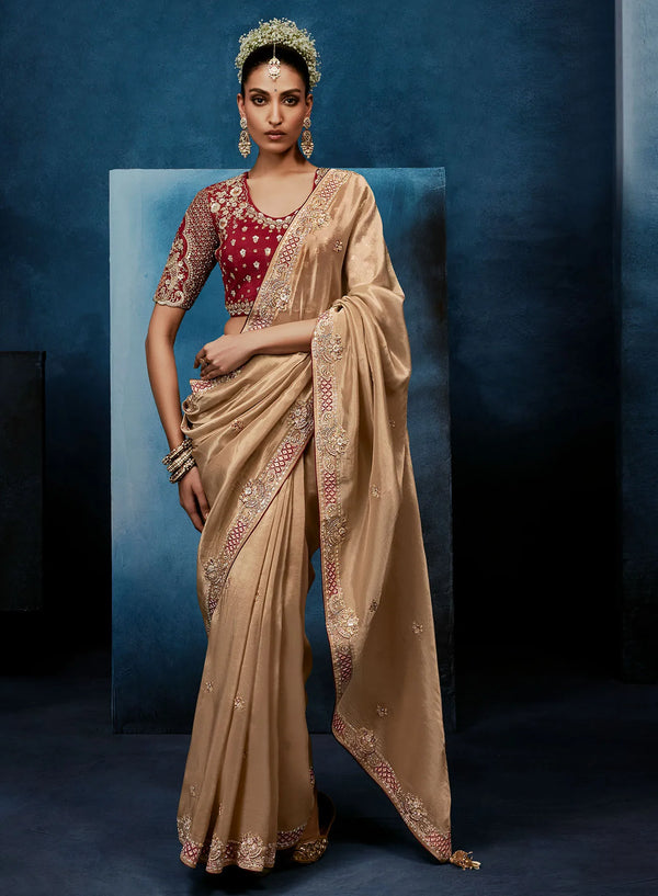 Beige Fancy Fabric Designer Saree showcasing a stunning maroon stitched blouse for luxury weddings | BharatPlaza