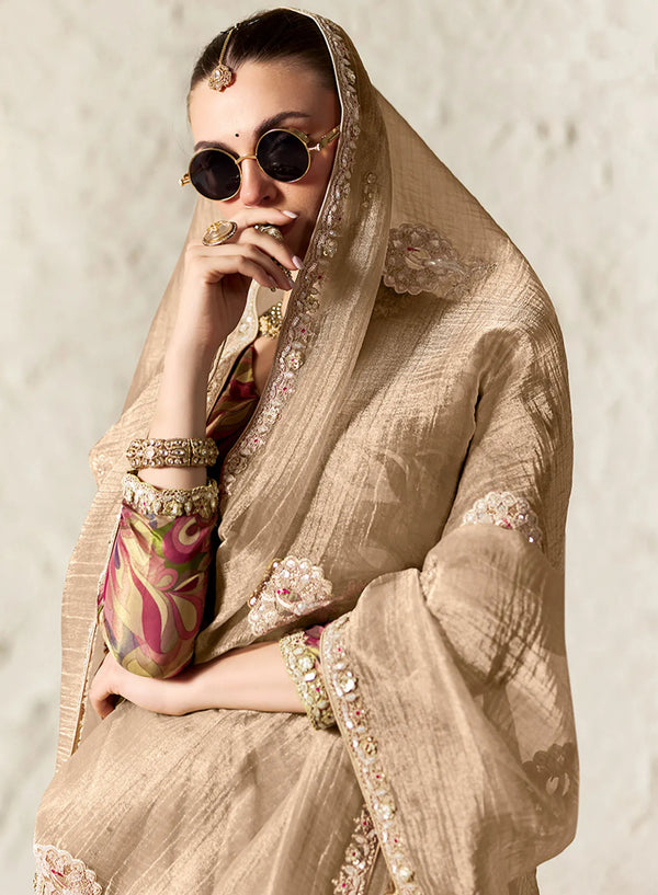 Elegant beige organza designer saree with embroidery for Singapore cocktail party