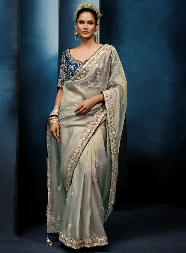 Silver Grey Fancy Fabric Designer Saree showcasing an elegant peacock motif blouse for luxury wedding wear | BharatPlaza