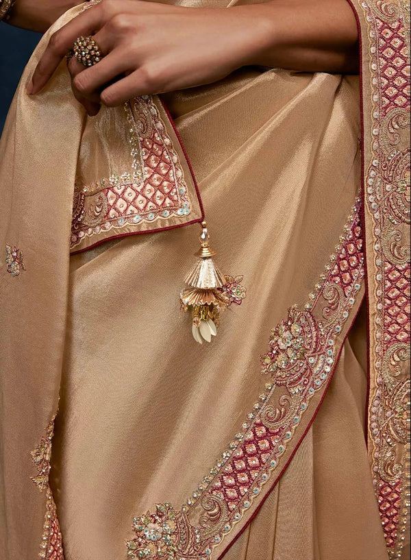 Beige Fancy Fabric Designer Saree featuring intricate embroidered borders and tassels for party wear | BharatPlaza